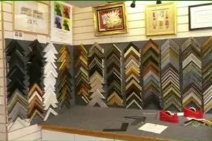 Frame moulding corner samples on the wall at Art Effects picture framers Southampton