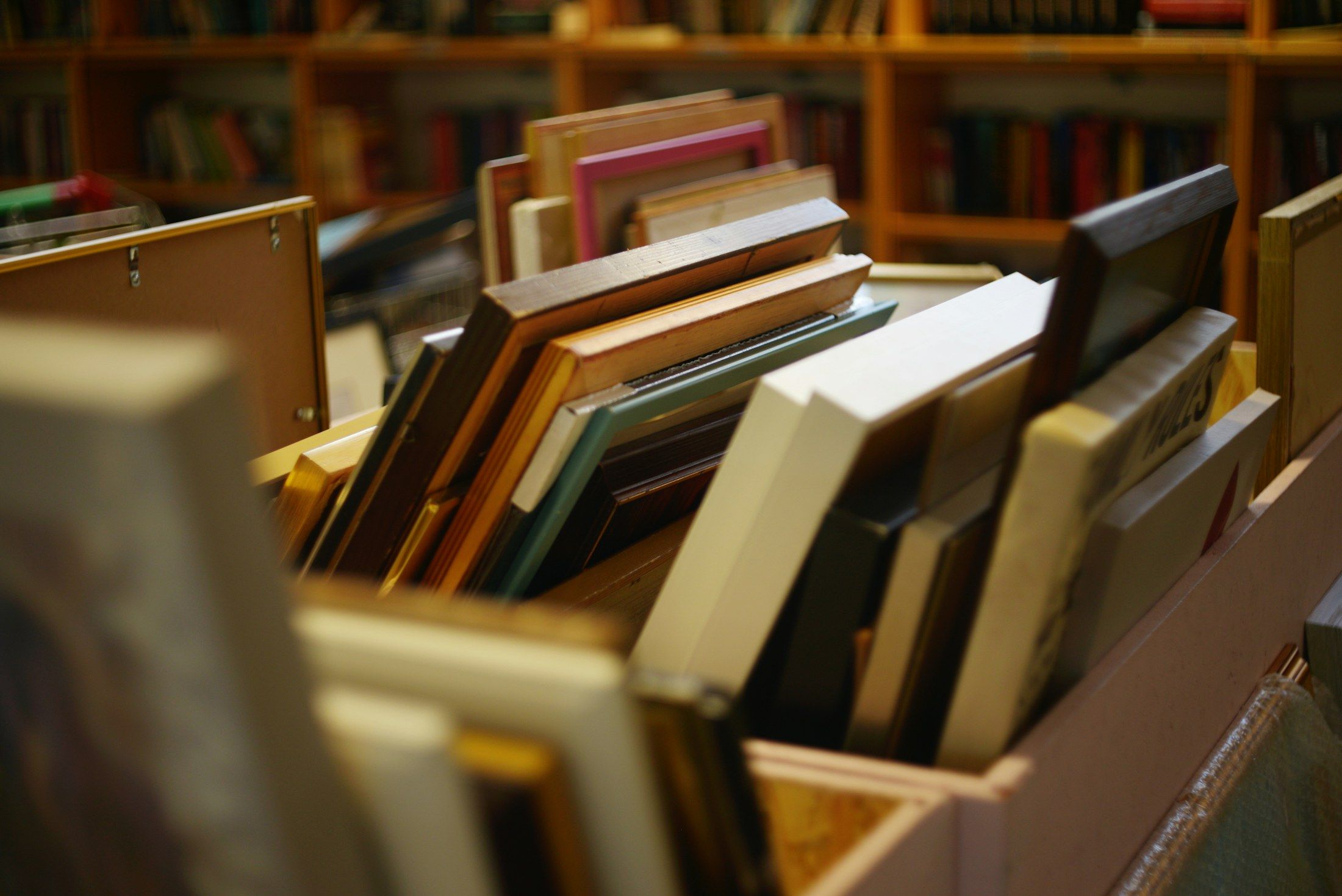 Box of assorted picture frames in a frame shop, framing services by Art Effects Southampton