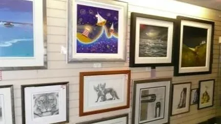 Framed limited edition prints on display inside the Art Effects shop in Southampton
