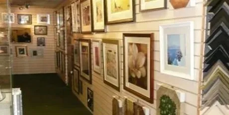 Wall of framed artwork in the Art Effects gallery, Southampton