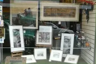 Framed portraits and prints in the Art Effects shop window, Southampton